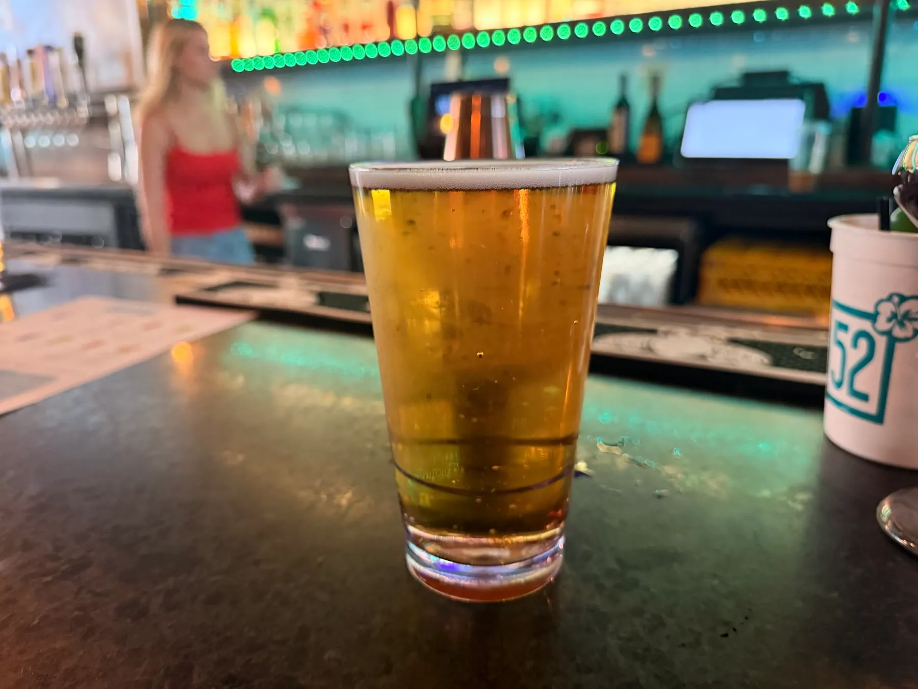 A draft beer on the Social 52 bar